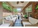 Relaxing covered patio with comfortable seating and a view of the backyard at 2212 Nichols Valley Drive, Dacula, GA 30019