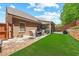 Charming patio includes a cozy seating area, ideal for outdoor relaxation and entertaining at 2212 Nichols Valley Drive, Dacula, GA 30019