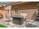 This outdoor patio boasts a cozy seating area and a stylish fire pit, perfect for social gatherings at 2212 Nichols Valley Drive, Dacula, GA 30019