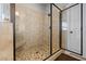 Modern tiled shower features a built-in seat and a sleek glass door at 2212 Nichols Valley Drive, Dacula, GA 30019