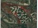 Aerial view showing the layout of the community surrounded by a creek and wooded areas at 302 Gilmer Ct, Canton, GA 30115