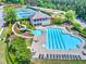 Aerial view of community amenities, including a pool, tennis courts, clubhouse, and playground at 302 Gilmer Ct, Canton, GA 30115