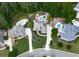 Aerial view showcasing homes, landscaped yards, and pools in a wooded neighborhood at 302 Gilmer Ct, Canton, GA 30115