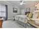 Comfortable bedroom with neutral tones, soft carpet, and a large window for natural light at 302 Gilmer Ct, Canton, GA 30115