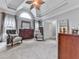 Large bedroom with a ceiling fan, plenty of space, and natural light from large windows at 302 Gilmer Ct, Canton, GA 30115