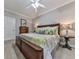 Spacious bedroom with carpet, a ceiling fan and a large window for natural light at 302 Gilmer Ct, Canton, GA 30115