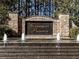 Elegant stone entrance to Governor's Preserve with water feature and lush landscaping at 302 Gilmer Ct, Canton, GA 30115
