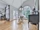 Bright dining area with large windows, modern lighting, and access to outdoor space at 302 Gilmer Ct, Canton, GA 30115