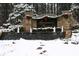 Festive community entrance adorned with holiday wreaths and snow-covered landscaping at 302 Gilmer Ct, Canton, GA 30115