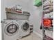 Bright laundry room with shelving and a front-load washer and dryer set at 302 Gilmer Ct, Canton, GA 30115