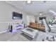 Inviting living room featuring a modern entertainment center and comfortable seating at 302 Gilmer Ct, Canton, GA 30115