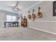 Living room featuring multiple guitars hanging on the wall, table, and lots of space at 302 Gilmer Ct, Canton, GA 30115