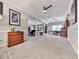 Spacious living room with a large carpeted floor, ceiling fan, and recessed lighting at 302 Gilmer Ct, Canton, GA 30115