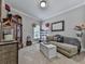 Inviting sitting room with stylish decor, soft lighting, and comfortable seating at 302 Gilmer Ct, Canton, GA 30115