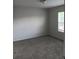 A cozy bedroom featuring plush carpeting and a window for natural light at 3242 Cascade Parc Sw Blvd, Atlanta, GA 30311