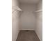 Walk-in closet with carpet and two wire racks for organized storage at 3242 Cascade Parc Sw Blvd, Atlanta, GA 30311