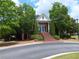 Community clubhouse featuring lush trees, manicured lawn, and brick facade at 3242 Cascade Parc Sw Blvd, Atlanta, GA 30311