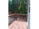 Spacious wooden deck with brown railing and views of surrounding trees at 3242 Cascade Parc Sw Blvd, Atlanta, GA 30311