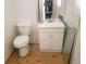 Bathroom with toilet, sink and mirror at 5927 Sherrie Ln, Powder Springs, GA 30127