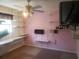Bedroom featuring shelving, ceiling fan, a television, and a window for natural light at 5927 Sherrie Ln, Powder Springs, GA 30127