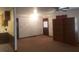 Spacious room with access to kitchen and featuring a ceiling fan and exterior door at 5927 Sherrie Ln, Powder Springs, GA 30127