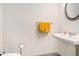 Neat half-bathroom featuring a pedestal sink, modern fixtures, and a wall-mounted mirror for a clean aesthetic at 2140 Ravencliff Dr, Austell, GA 30168