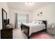 Comfortable bedroom with natural light, dresser, decorative pillows, and stylish furnishings at 2140 Ravencliff Dr, Austell, GA 30168