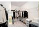 Spacious walk-in closet with ample shelving, hanging space, mirror and carpet flooring at 2140 Ravencliff Dr, Austell, GA 30168