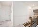 Bright hallway featuring neutral walls, carpet floors, and access to various rooms for convenient navigation at 2140 Ravencliff Dr, Austell, GA 30168