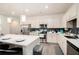 Beautiful kitchen featuring stainless steel appliances, a white countertop island, and gray backsplash at 2140 Ravencliff Dr, Austell, GA 30168