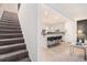 Bright kitchen with an open concept layout, island with seating, and stairs nearby at 2140 Ravencliff Dr, Austell, GA 30168