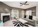 Modern living room boasts a cozy fireplace, comfortable seating, and stylish decor for relaxation and entertaining at 2140 Ravencliff Dr, Austell, GA 30168