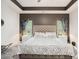 Spacious main bedroom with a tray ceiling, elegant decor, and ample natural light for a peaceful sanctuary at 2140 Ravencliff Dr, Austell, GA 30168