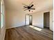 Bedroom boasts neutral walls, a ceiling fan, and a closet for ample storage at 2535 Impala Dr, Cumming, GA 30041