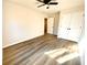 A bedroom with a ceiling fan, with an entrance and closet that have matching white doors at 2535 Impala Dr, Cumming, GA 30041