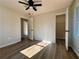 Bedroom boasts neutral walls, a ceiling fan, closet, and hardwood flooring at 2535 Impala Dr, Cumming, GA 30041