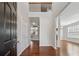 Open entryway with hardwood floors and a view into the living areas at 3134 Flery Way, Lawrenceville, GA 30046