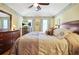 Spacious bedroom with a ceiling fan, large bed, and decorative wall trim at 5070 Saddle Bridge Ln, Alpharetta, GA 30022