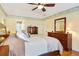 Comfortable bedroom features a ceiling fan, natural light, and decorative wall trim at 5070 Saddle Bridge Ln, Alpharetta, GA 30022