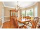 Dining room with hardwood floors, chandelier, and molding and large windows at 5070 Saddle Bridge Ln, Alpharetta, GA 30022