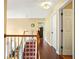 Hallway with hardwood floors and access to multiple rooms at 5070 Saddle Bridge Ln, Alpharetta, GA 30022