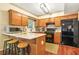 Updated kitchen boasts granite countertops, stainless steel appliances, and wooden cabinets at 5070 Saddle Bridge Ln, Alpharetta, GA 30022