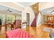 Spacious living area with hardwood floors, comfortable seating, and an open layout to the dining room at 5070 Saddle Bridge Ln, Alpharetta, GA 30022