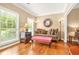 Comfortable sitting room with hardwood floors, large windows, and classic furnishings with natural light at 5070 Saddle Bridge Ln, Alpharetta, GA 30022
