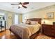 Cozy bedroom features hardwood floors, tray ceilings, and bright natural light at 5070 Saddle Bridge Ln, Alpharetta, GA 30022