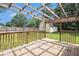 Backyard deck with a wooden pergola offers a relaxing space for enjoying the outdoor view at 578 Laney Rd, Locust Grove, GA 30248