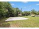 Backyard features a basketball court and an open grass area, perfect for outdoor activities at 578 Laney Rd, Locust Grove, GA 30248