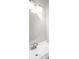 Bathroom with round mirror, vanity, and lighting at 578 Laney Rd, Locust Grove, GA 30248