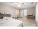 Spacious bedroom with neutral carpet, ceiling fan, and a private bathroom at 578 Laney Rd, Locust Grove, GA 30248