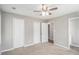 View of the bedroom highlighting the ceiling fan and closet with neutral color scheme at 578 Laney Rd, Locust Grove, GA 30248